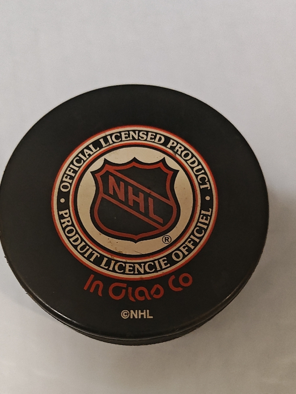 NHL Black Hockey Puck with Red & White Crest
